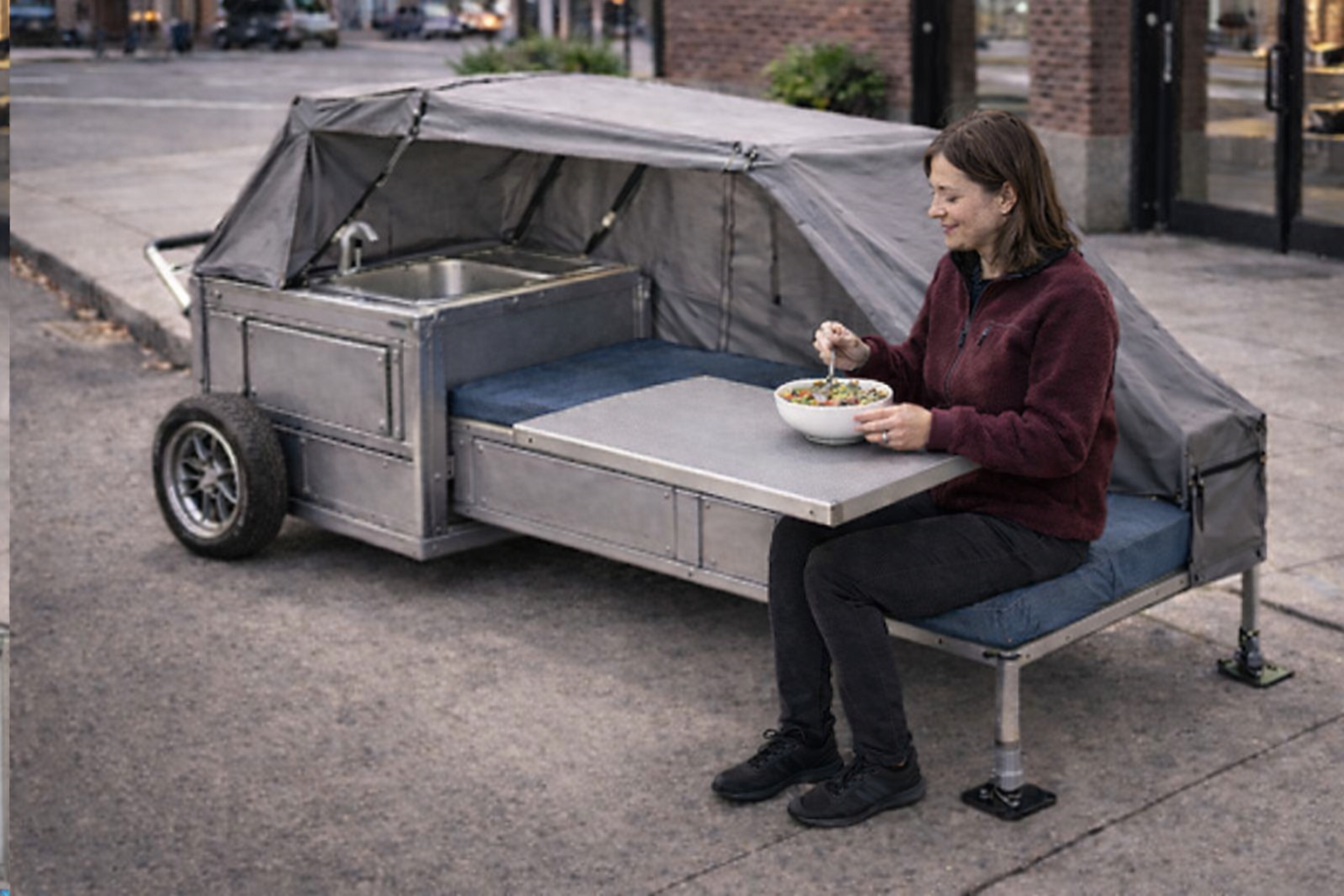 Woman eating at table in MCSU+H unit